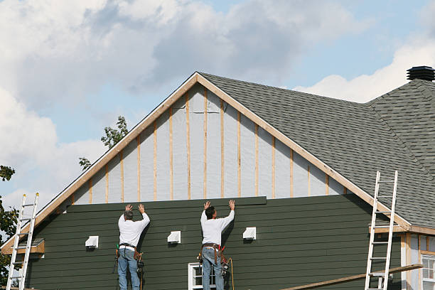 Professional Siding Installation technician working in Woodstock, MD